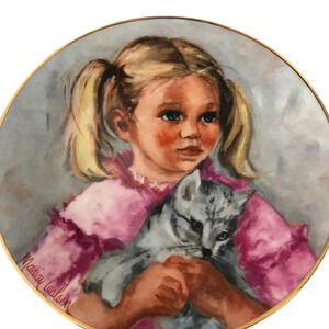 The Brantwood collection cat and little girl.